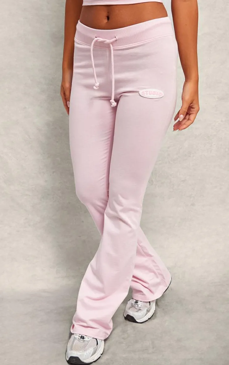 Discount PrettyLittleThing Studio Badge Detail Drawstring Flared Pants Baby Pink