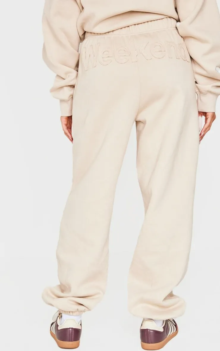 PrettyLittleThing Washed Weekend Applique Thin Waistband Cuffed Sweatpants Beige