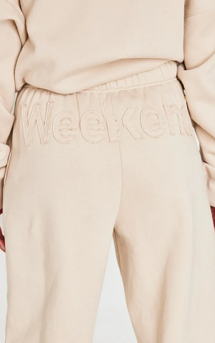 PrettyLittleThing Washed Weekend Applique Thin Waistband Cuffed Sweatpants Beige