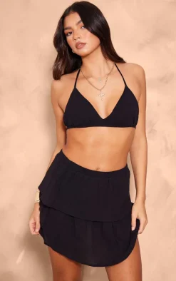 Online PrettyLittleThing Crinkle Texture Tiered Mini Skirt Black