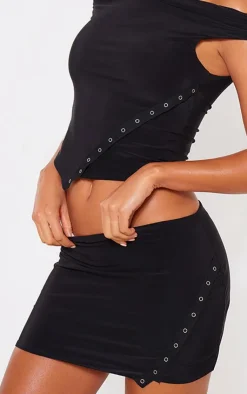 Hot PrettyLittleThing Slinky Low Rise Slit Hem Eyelet Detail Micro Mini Skirt Black