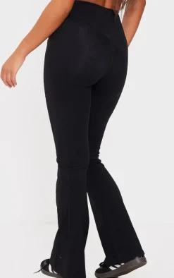 New PrettyLittleThing Snatched Sculpt Wrap Waistband Ruched Bum Flares Black