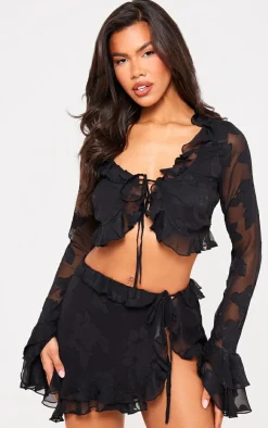 PrettyLittleThing Textured Chiffon Tie Side Frilly Mini Skirt Black