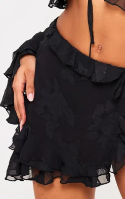 PrettyLittleThing Textured Chiffon Tie Side Frilly Mini Skirt Black
