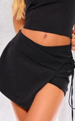 Online PrettyLittleThing Woven Tailored Asymmetric Pinstripe Micro Mini Skort Black