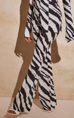 Online PrettyLittleThing Zebra Print Chiffon Flare Pants Black