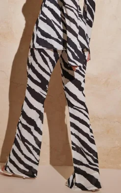 Online PrettyLittleThing Zebra Print Chiffon Flare Pants Black