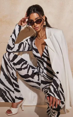 Online PrettyLittleThing Zebra Print Chiffon Flare Pants Black