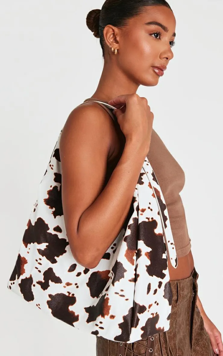 PrettyLittleThing Shoppers*Pu Cow Print Slouchy Oversized Tote Bag
