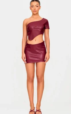 Online PrettyLittleThing Faux Leather Asymmetric Hem Mini Skirt Burgundy