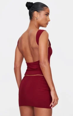 Online PrettyLittleThing Slinky Open Back Cap Sleeve Longline Top Burgundy