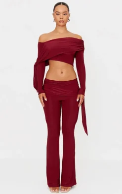 Online PrettyLittleThing Slinky Ruched Tie Detail Flare Pants Burgundy
