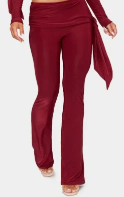 Online PrettyLittleThing Slinky Ruched Tie Detail Flare Pants Burgundy