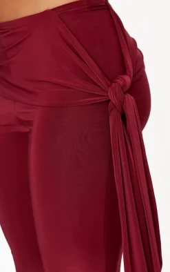 Online PrettyLittleThing Slinky Ruched Tie Detail Flare Pants Burgundy