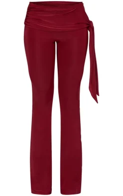 Online PrettyLittleThing Slinky Ruched Tie Detail Flare Pants Burgundy