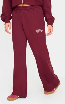 Online PrettyLittleThing Studio Archives Embroidered Wide Leg Sweatpants Burgundy
