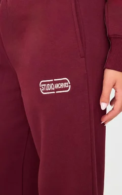Online PrettyLittleThing Studio Archives Embroidered Wide Leg Sweatpants Burgundy