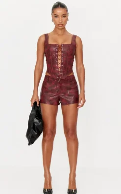 PrettyLittleThing Washed Faux Leather Hot Pants Burgundy