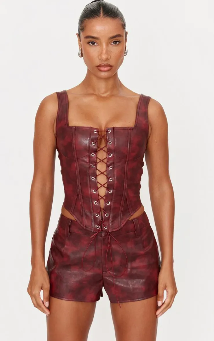 PrettyLittleThing Washed Faux Leather Hot Pants Burgundy
