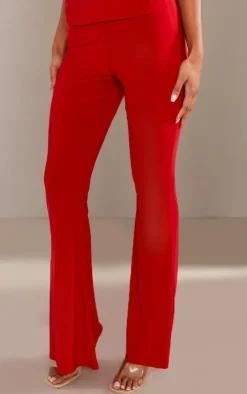PrettyLittleThing Slinky Low Rise Flared Pants Cherry Red
