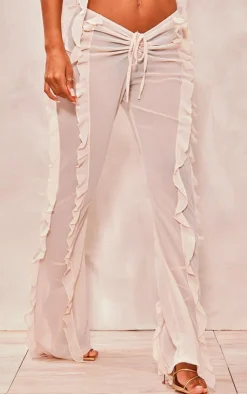 Discount PrettyLittleThing Chiffon Ruffle Dipped Waist Flared Pants Cream