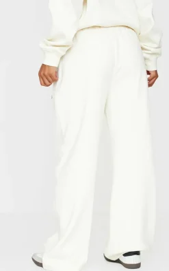New PrettyLittleThing Contrast Embroidered Saint Louis Low Rise Wide Leg Sweatpants Cream