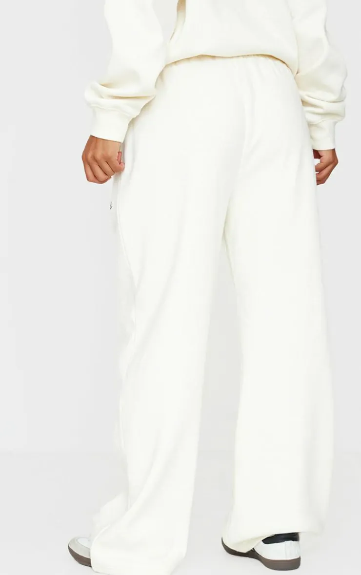 New PrettyLittleThing Contrast Embroidered Saint Louis Low Rise Wide Leg Sweatpants Cream