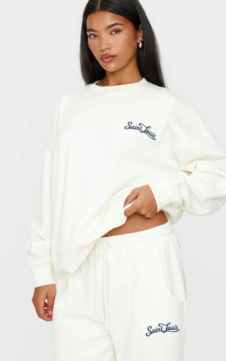 New PrettyLittleThing Contrast Embroidered Saint Louis Low Rise Wide Leg Sweatpants Cream