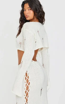 New PrettyLittleThing Distressed Knit Lace Up Flared Sleeve Cropped Sweater Cream