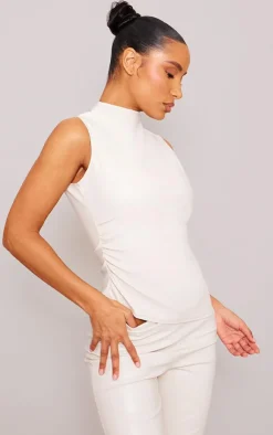 Online PrettyLittleThing Faux Leather High Neck Asymmetric Hem Side Ruched Top Cream