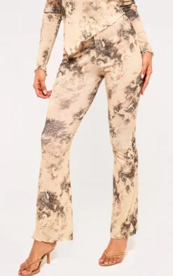 Online PrettyLittleThing Onion Skin Printed Hem Detail Flared Pants Cream