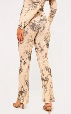 Online PrettyLittleThing Onion Skin Printed Hem Detail Flared Pants Cream