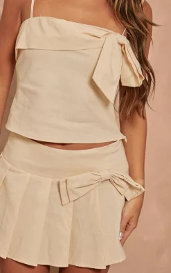 PrettyLittleThing Woven Bow Mid Rise Skater Skirt Cream