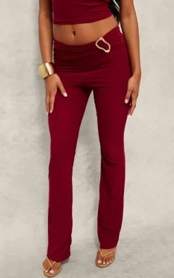 Discount PrettyLittleThing Slinky Fold Over Metal Trim Skinny Flare Pants Dark Red