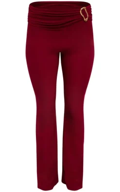 Discount PrettyLittleThing Slinky Fold Over Metal Trim Skinny Flare Pants Dark Red