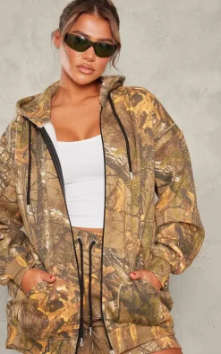 Online PrettyLittleThing Green Forest Camo Black Badge Zip Up Oversized Hoodie Forest Green