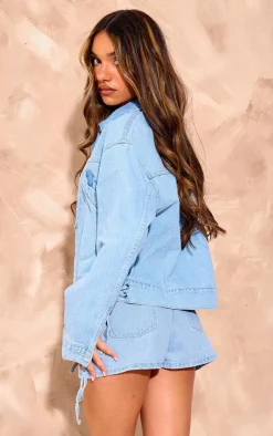 Online PrettyLittleThing Lace Up Bow Detail Cropped Denim Jacket Light Blue Wash
