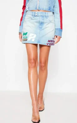Sale PrettyLittleThing Racer Graphic Denim Mini Skirt Light Blue Wash