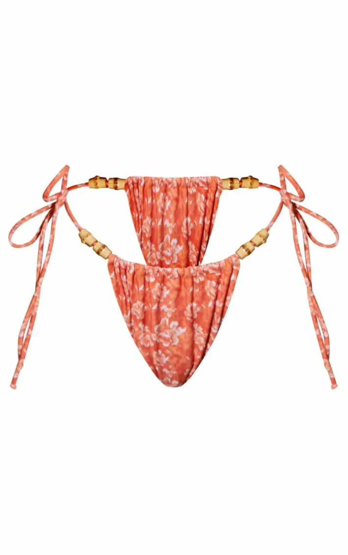 Orange Flower Print Wooden Bead Ruched Tie Side Bikini Bottoms