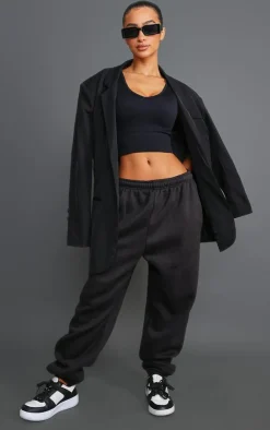PrettyLittleThing Snatched*Petite Plunge Detail Snatched Rib Crop Top