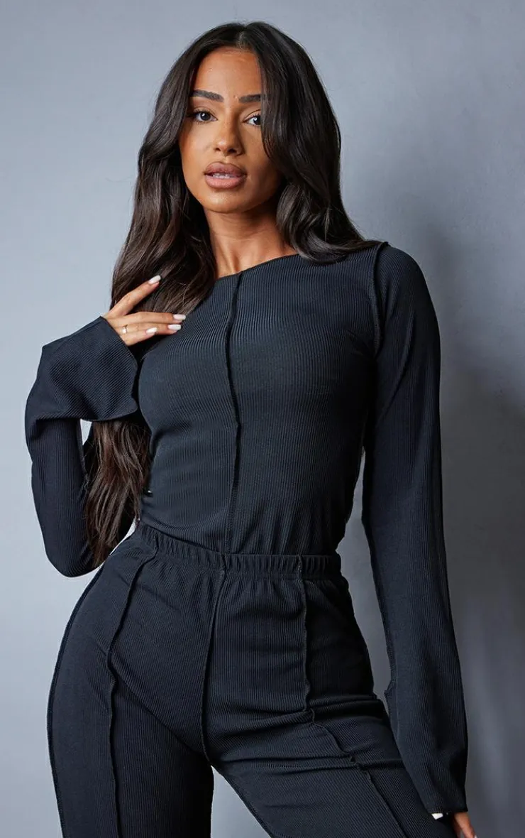 Online PrettyLittleThing Petite Ribbed Seam Detail Long Sleeve Top Black