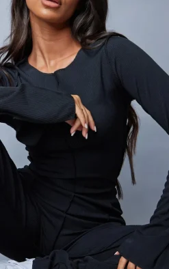 Online PrettyLittleThing Petite Ribbed Seam Detail Long Sleeve Top Black