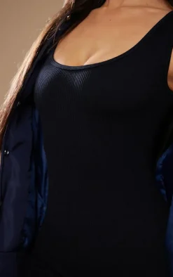 PrettyLittleThing Snatched*Petite Structured Snatched Ribbed Scoop Neck Jumpsuit