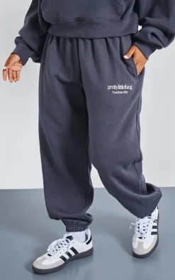 Online PrettyLittleThing Petite Graphic Cuffed Sweatpants Charcoal
