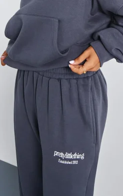 Online PrettyLittleThing Petite Graphic Cuffed Sweatpants Charcoal