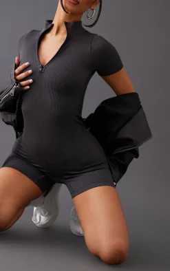 PrettyLittleThing Unitards*Petite Snatched Rib Zip Front Unitard