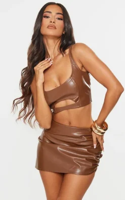 Online PrettyLittleThing Petite Cut Out Front Faux Leather Crop Top Chocolate