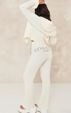 Best PrettyLittleThing Petite Athletic Sport Embroidered Knit Flared Pants Cream