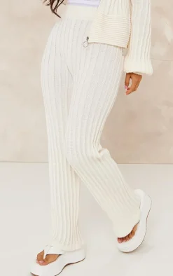 Best PrettyLittleThing Petite Athletic Sport Embroidered Knit Flared Pants Cream
