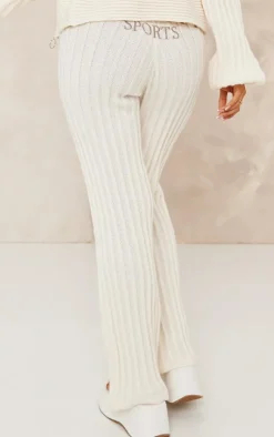 Best PrettyLittleThing Petite Athletic Sport Embroidered Knit Flared Pants Cream
